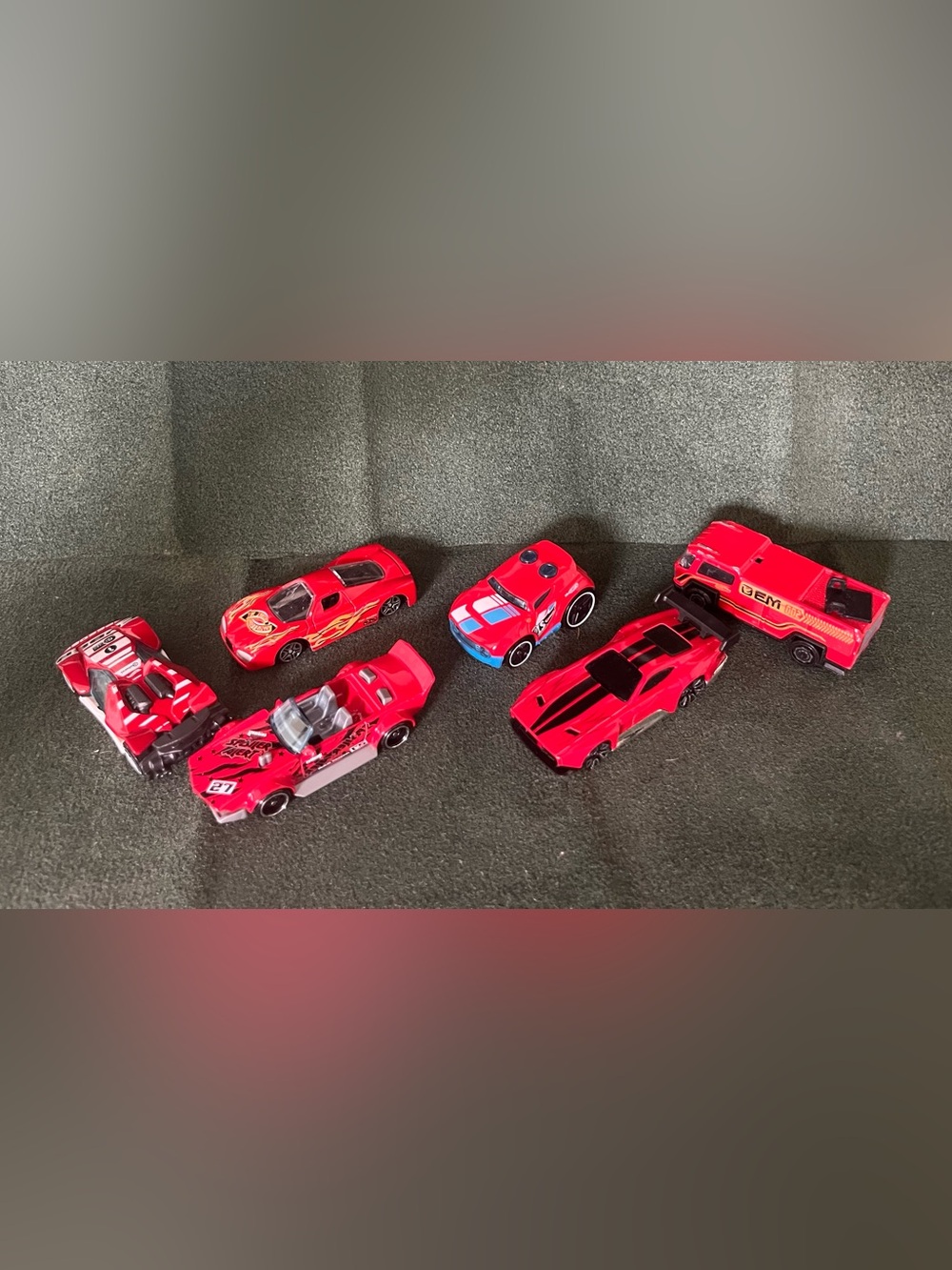 Red Assorted Brands of Die-Cast Racing Cars